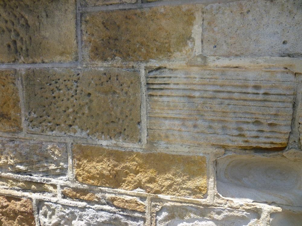 Convicts began cutting and laying these blocks in 1822, more than a century and a half before the wall became a meeting place for the young men who gave The Wall its name.